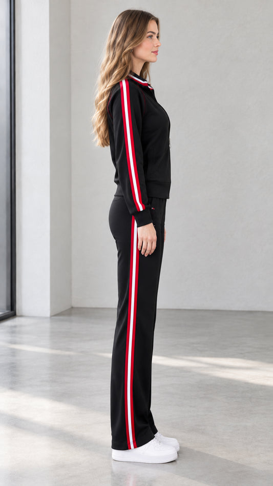 Side profile view of black zip jacket and side-striped track pants set