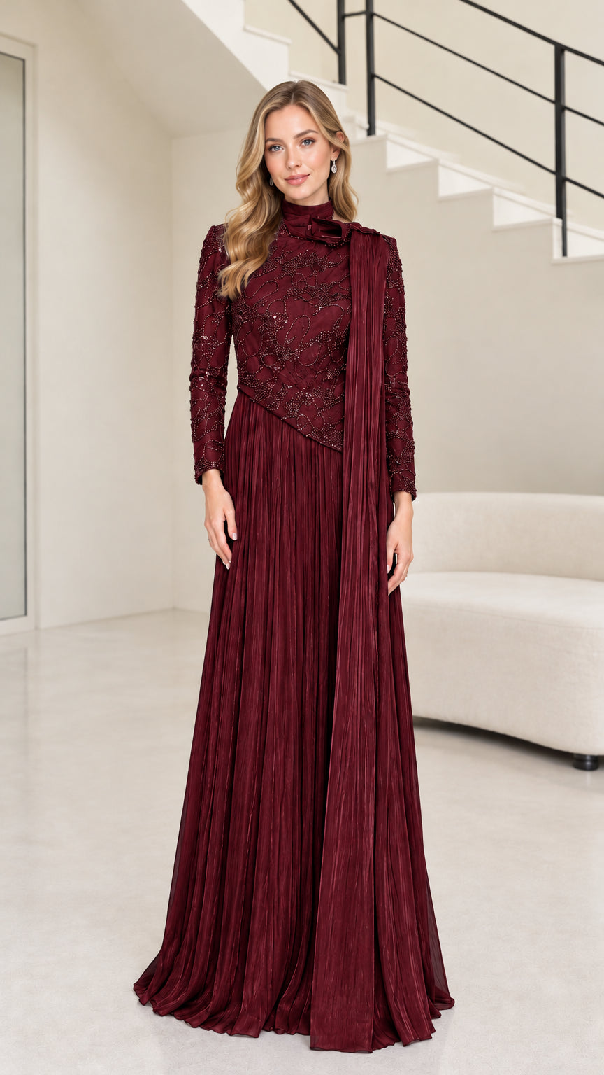 Front full-length view of burgundy red long sleeve beaded mock neck pleated maxi gown