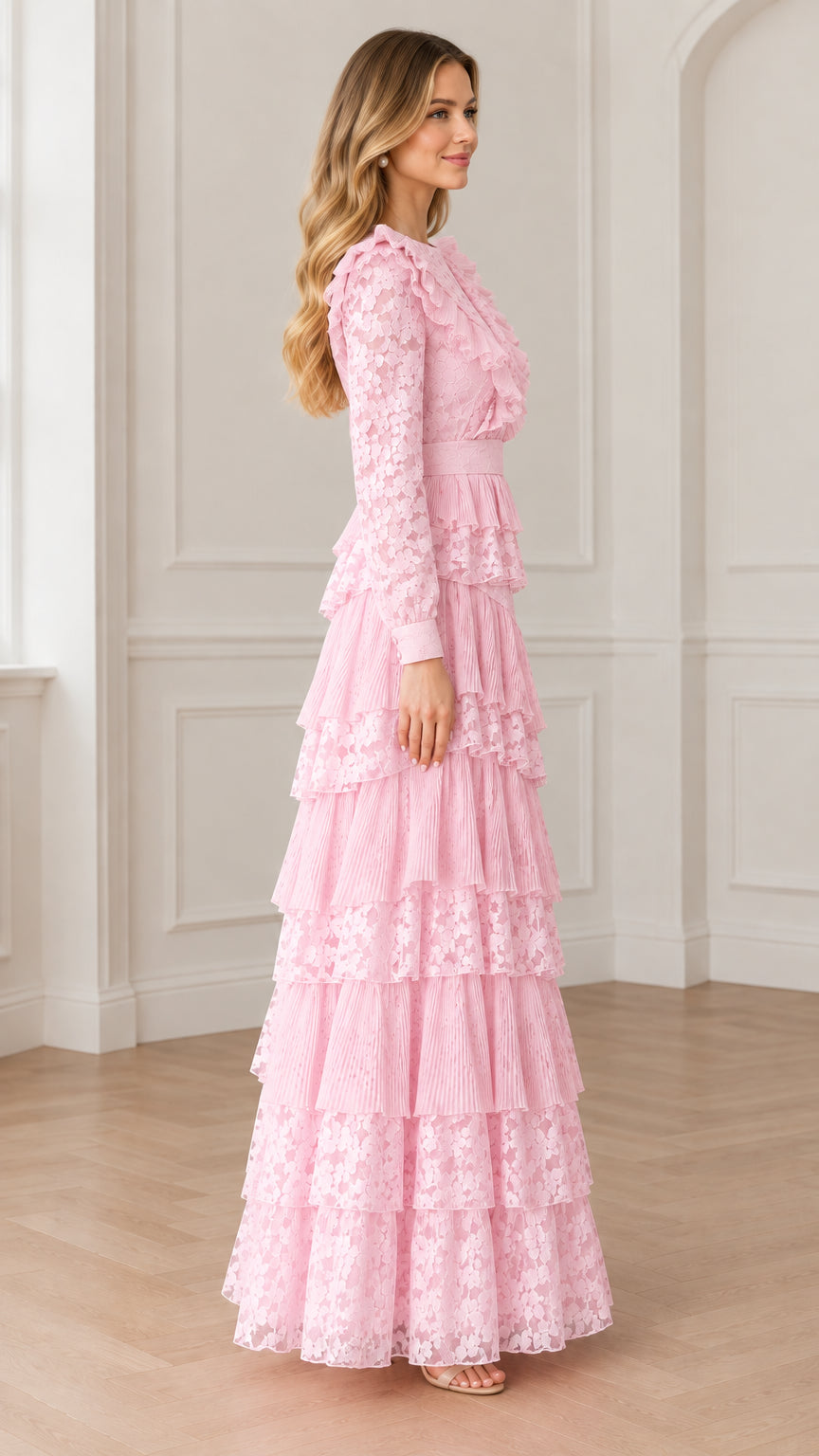 Side view of model in pastel pink ruffle tiered lace evening gown