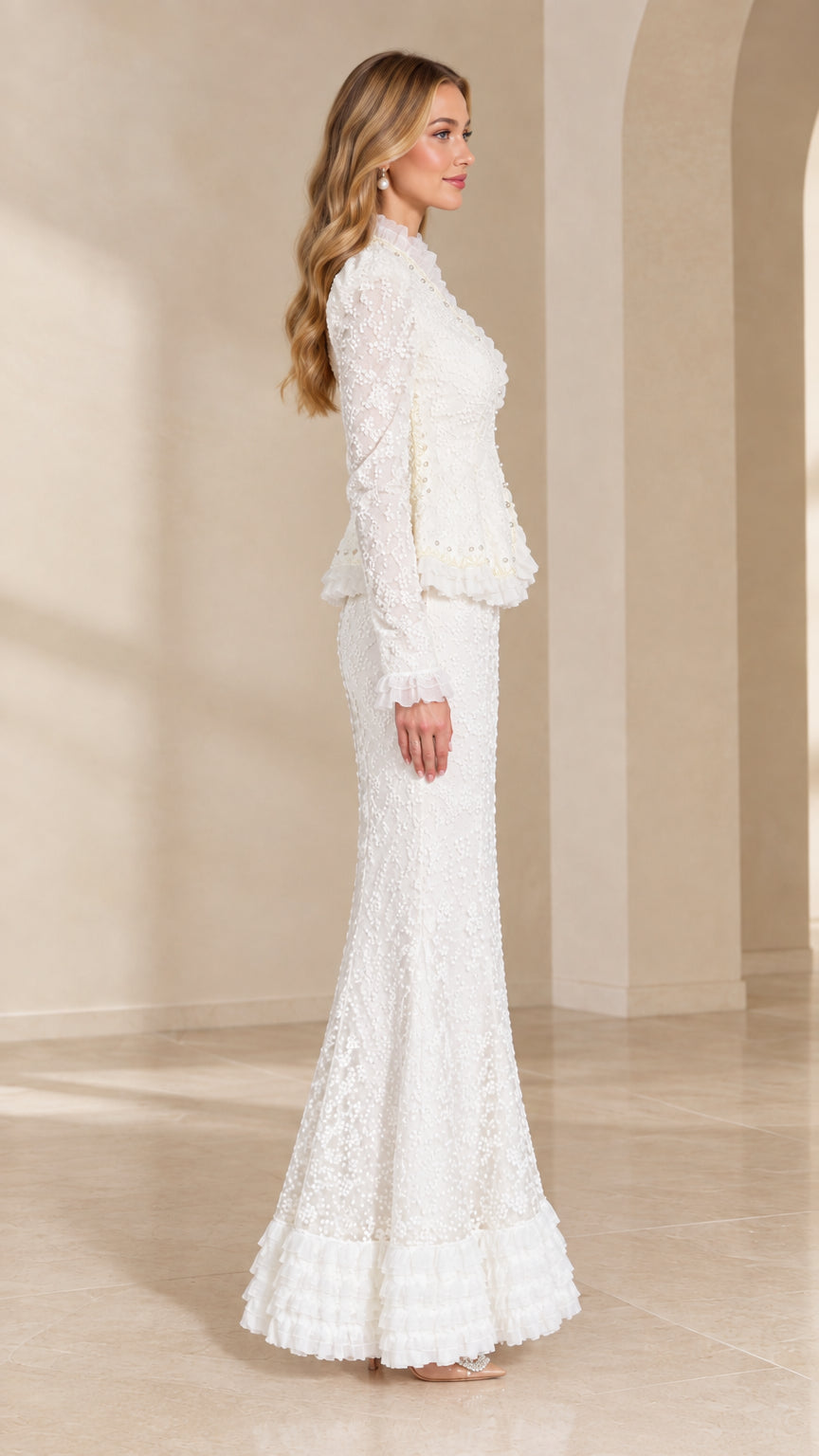 Side view of woman wearing white lace peplum evening set