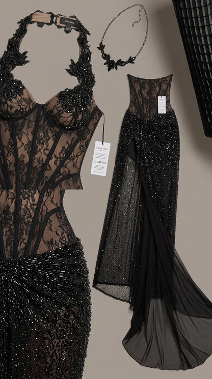 Detailed flat lay of black embellished corset top and beaded skirt