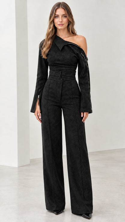 Front view of model wearing black one-shoulder wide-leg jumpsuit