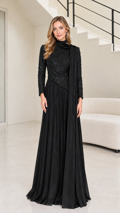 Front full-length view of black long sleeve beaded mock neck pleated maxi evening gown