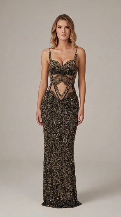 Model wearing black beaded evening gown with black lace cutout bodice