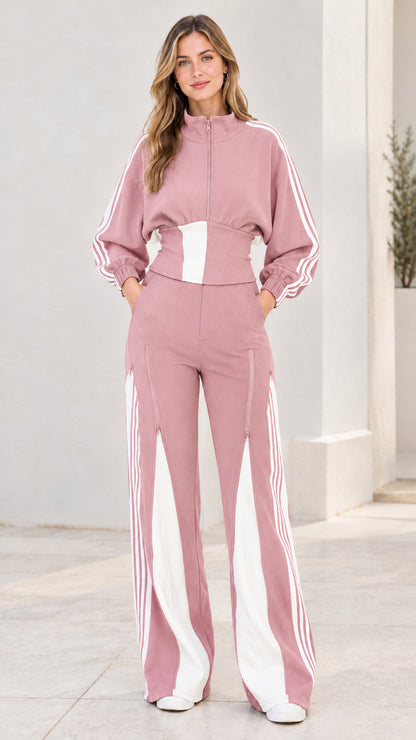 Front view of model wearing dusty pink two-piece striped tracksuit set