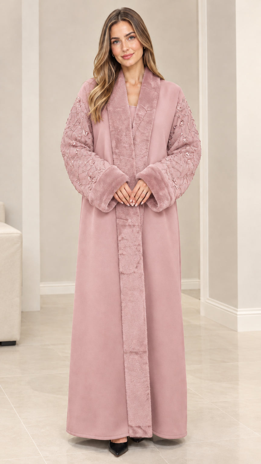 Front view of model wearing dusty pink faux fur trim sequin abaya coat