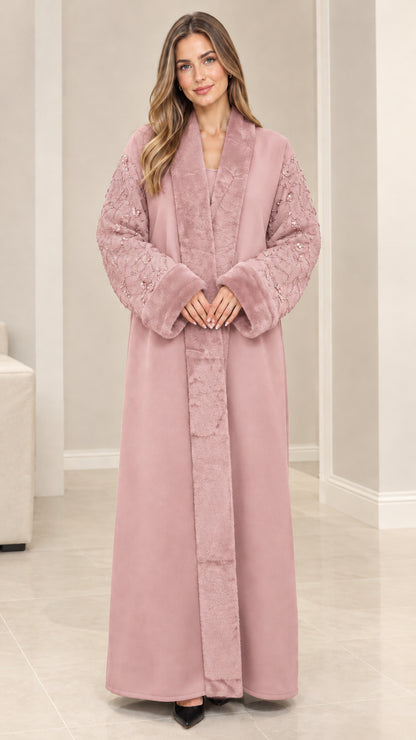 Front view of model wearing dusty pink faux fur trim sequin abaya coat