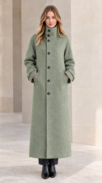 Front view of woman wearing sage green high neck winter maxi coat