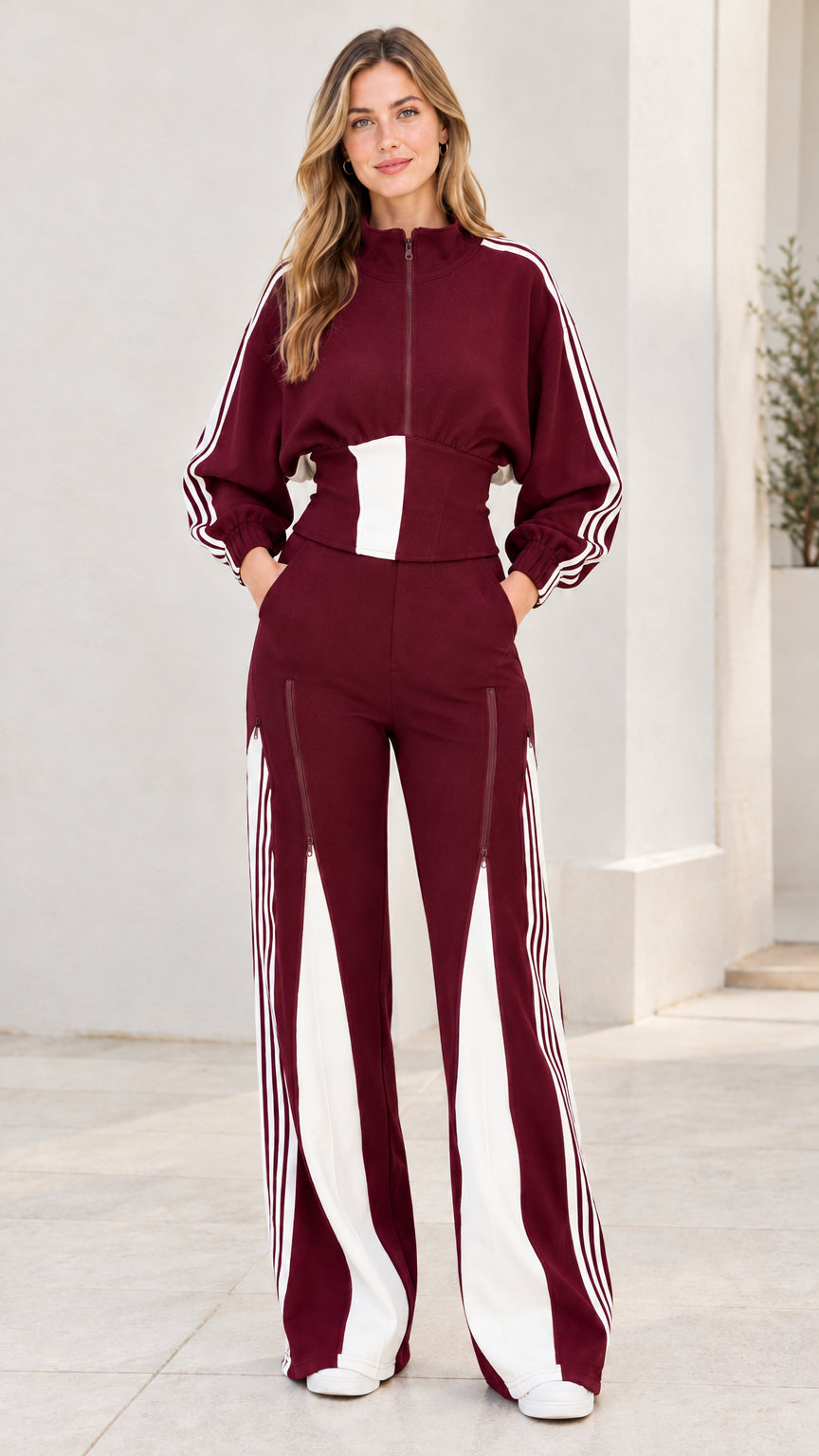 Front view of model wearing burgundy wine red two-piece striped tracksuit set
