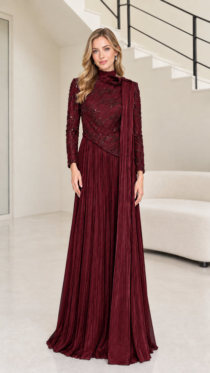 Front full-length view of burgundy red long sleeve beaded mock neck pleated maxi gown
