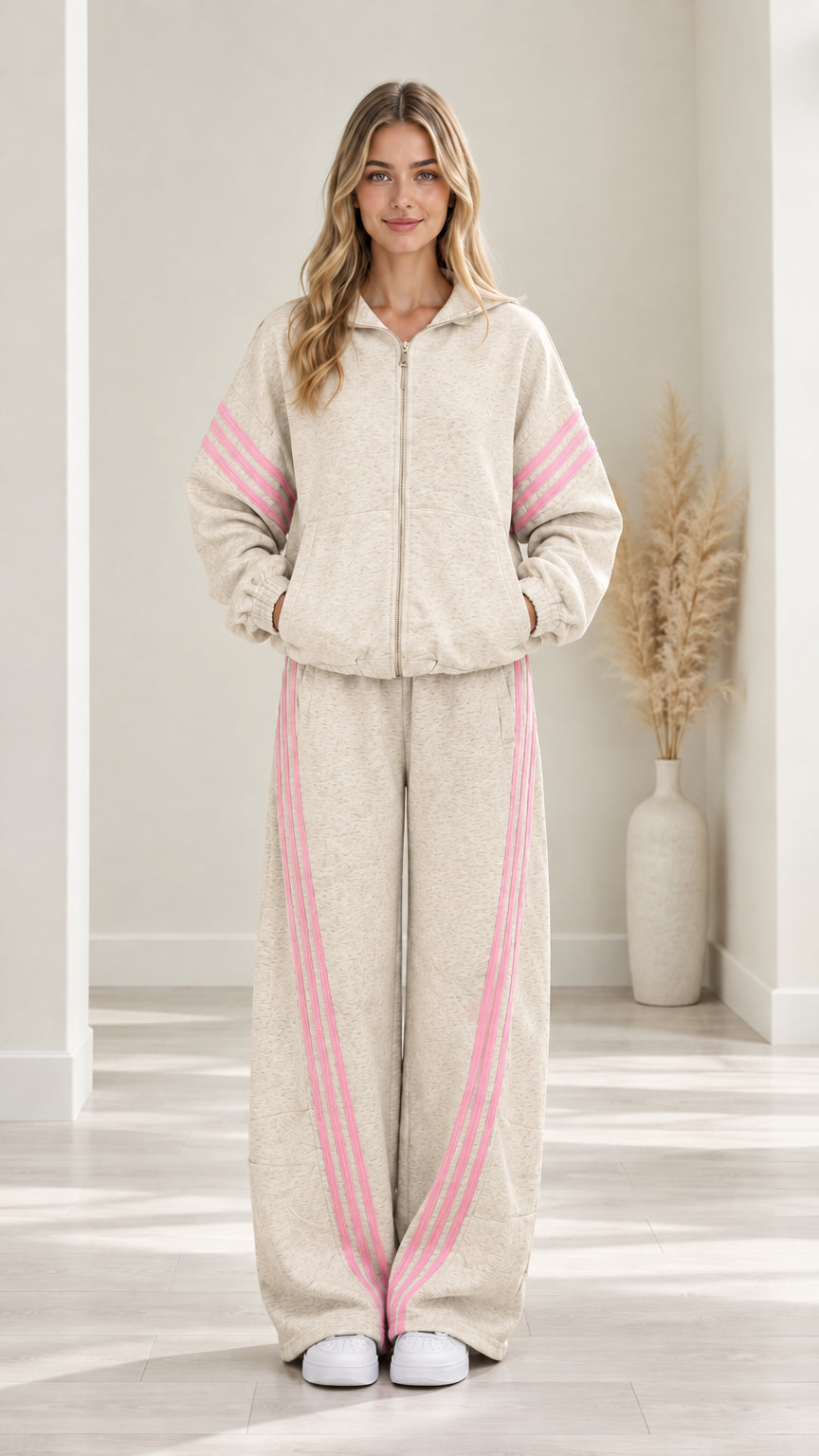 Woman modeling Oatmeal two-piece fleece tracksuit set with pink contrast stripes